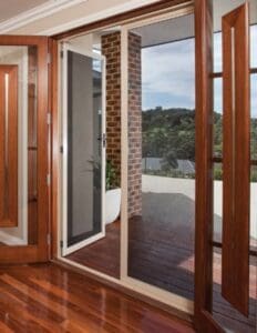 Showing timber doors and flyscreen installation leading to verandah