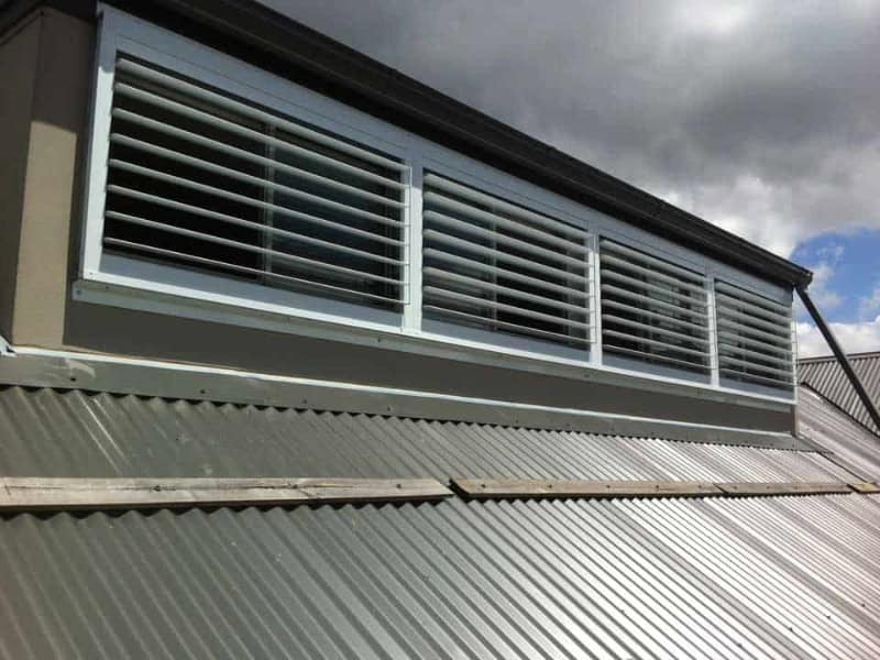 Roof dormer fitted with exterior shutters on windows for airflow and protection