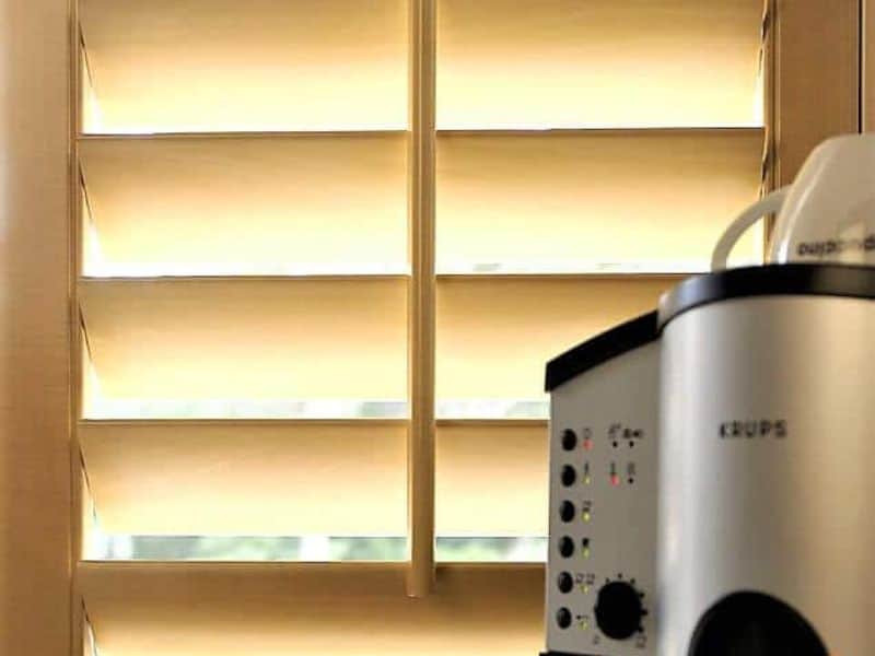 Outdoor shutters for decks create privacy while keeping your indoor dining area bright.