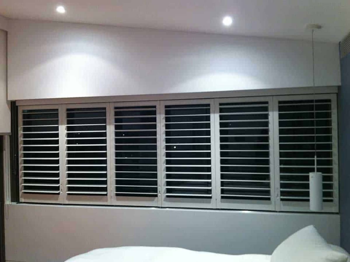 Dark plantation shutters colours help you balance privacy, style and natural light in modern bathrooms.
